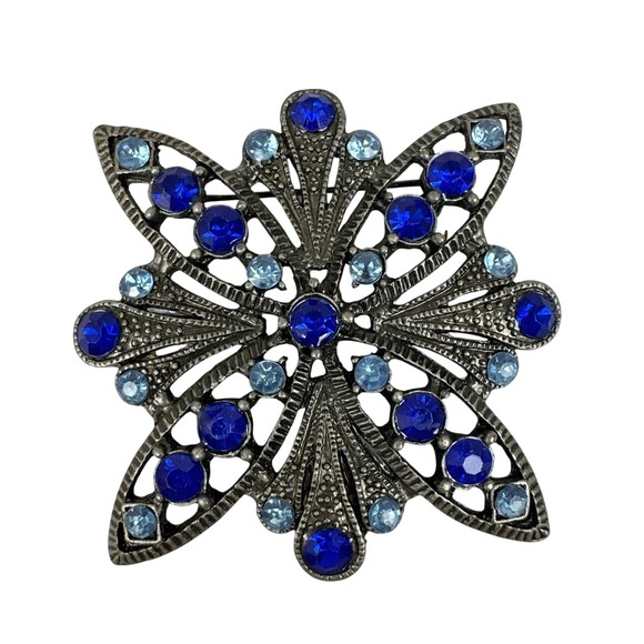 Blue Light Jewelry - Vintage Blue Rhinestone Floral Brooch Silver Tone Starburst Pin